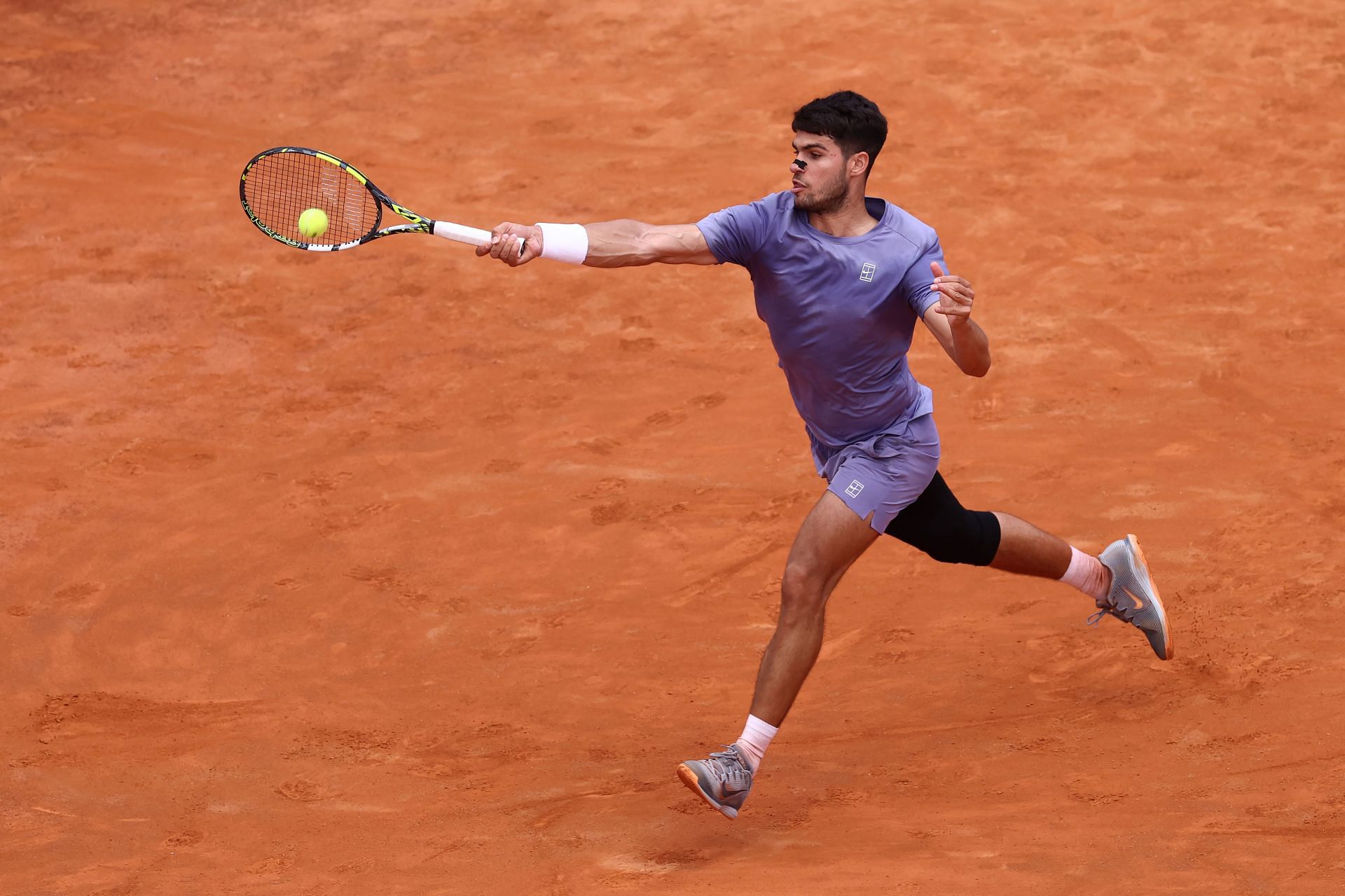 Alcaraz plays a forehand in the Italian Open 2025 - Day Nine - Source: Getty